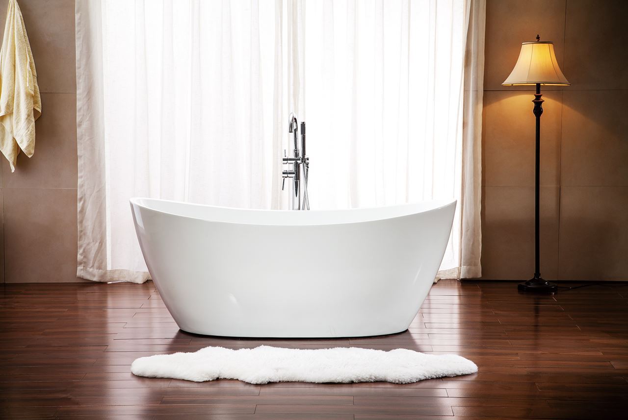 Freestanding Evos Boutiques Bath in room with wood floors.