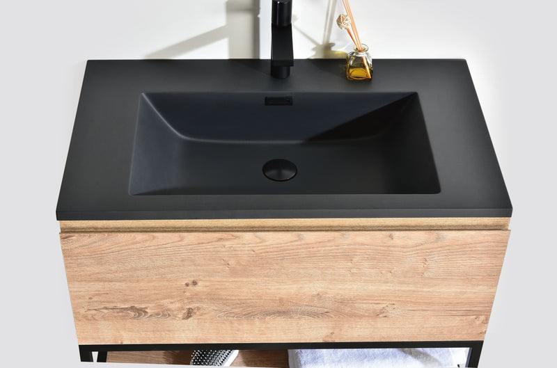Evos Boutiques 32 in freestanding vanity with black top looking down