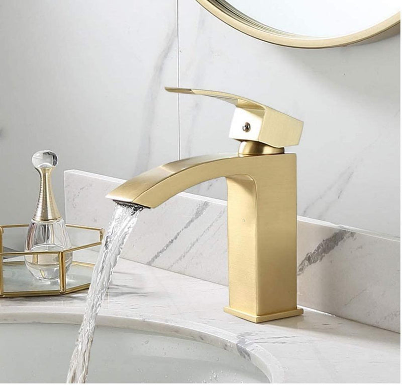 Evos Boutiques gold faucet running water