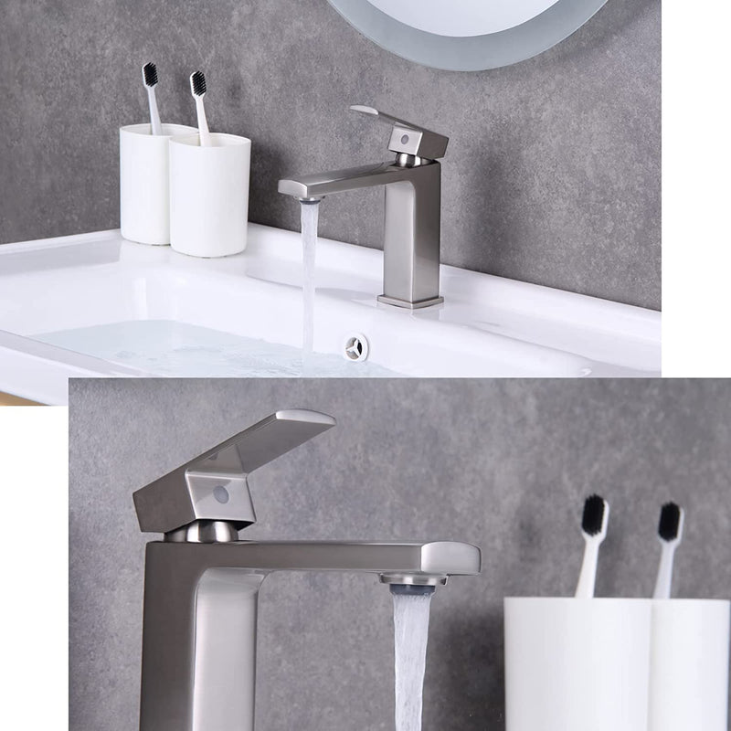 Evos Boutiques grey faucet zoomed in running water